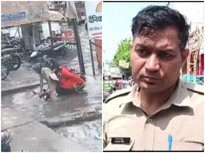 uttar pradesh news viral video shows up police man dayanand singh with wife fall open big drain aligarh | वीडियो: देखते ही देखते स्कूटर पर सवार पुलिस वाला और उसकी पत्नी जा गिरे विशाल नाले में और फिर....., कैमरे में कैद हुआ दुर्घटना