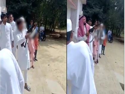 viral Video Bullets fired from minor children UP Pratapgarh district elderly kept filling rifles getting fired police took strong action | Video: यूपी में नाबालिग बच्चों से चलवाई गई गोलियां, बुजुर्ग भरता रहा राइफल और करवाता गया ताबड़तोड़ फायरिंग, पुलिस ने लिया कड़ा एक्शन