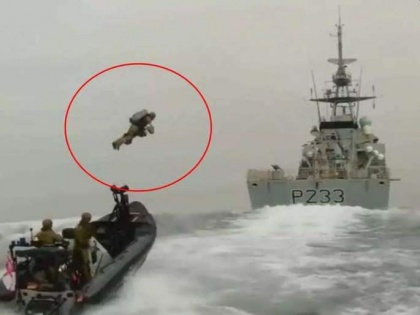 VIDEO Soldier flies one boat another ship help jet pack see viral UK Royal Marines | VIDEO: जेट पैक की मदद से नाव से दूसरे जहाज पर जाते सैनिक, वीडियो देख हो जाएंगे हैरान