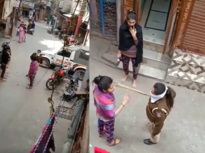 coronavirus lockdown lady constable beat a girl on road video viral on social media | Coronavirus: घर से बाहर निकली एक लड़की पर बरसे पुलिस के डंडे, वीडियो सोशल मीडिया पर वायरल