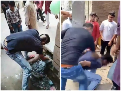 viral Video new delhi wazirabad victim shakeel head first shaved charge theft entire drain cleaned case registered | Video: चोरी के आरोप में एक शख्स का पहले मुंडवाया गया सिर फिर नाली साफ करने को किया गया मजबूर