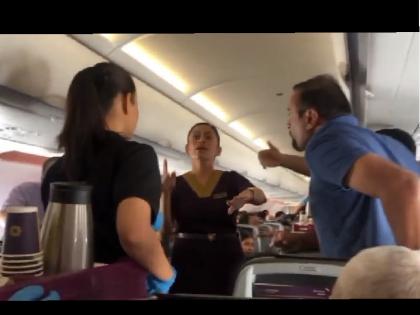 Vistara flight viral video Father lost his temper after molesting daughter in a flying plane video of heated argument with passenger went viral | उड़ते विमान में बेटी के साथ छेड़छाड़ से पिता ने खोया आपा, यात्री के साथ तीखी बहस का वीडियो वायरल Vistara flight viral video Father lost his temper after molesting daughter in a flying plane video of heated argument with passenger went viral | उड़ते विमान में बेटी के साथ छेड़छाड़ से पिता ने खोया आपा, यात्री के साथ तीखी बहस का वीडियो वायरल