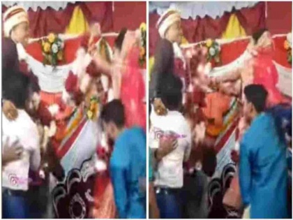funny viral video of marriage where bride made a lot of effort in varmala rasm | दूल्हे को वरमाला पहनाने के लिए दुल्हन को करनी पड़ी ज्यादा मेहनत, सोशल मीडिया पर वायरल हुआ मजेदार वीडियो