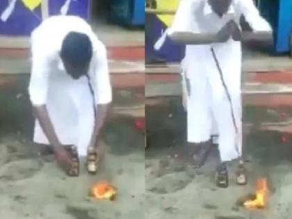 tamilnadu man worships bottle of liquor after government permits reopening of liquor shops | कभी देखा है ऐसा! ठेका खुला और शराब की बोतल लेकर बीच सड़क पर पूजा करने लगा शख्स, देखें वीडियो