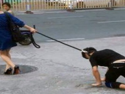 Woman walks her husband on a leash to get around curfew in canada quebec city | पति के गले में कुत्ते का पट्टा डालकर घुमा रही थी महिला, पुलिस ने लगाया 2 लाख का जुर्माना, ये है पूरा मामला