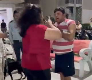 Viral Video Woman enraged after missing dog poster gets torn holds society president's collar and slaps him | Watch: लापता कुत्ते का पोस्टर फटने पर भड़की महिला, सोसायटी अध्यक्ष का कॉलर पकड़ जड़े थप्पड़ Viral Video Woman enraged after missing dog poster gets torn holds society president's collar and slaps him | Watch: लापता कुत्ते का पोस्टर फटने पर भड़की महिला, सोसायटी अध्यक्ष का कॉलर पकड़ जड़े थप्पड़