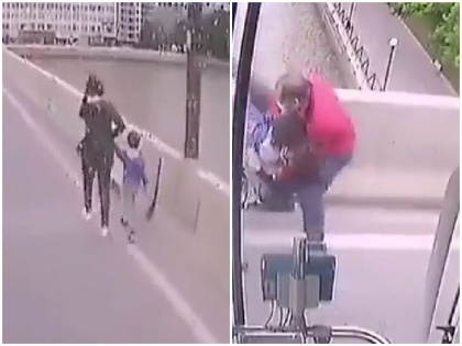 women want to suicide with kids from bridge saves these way viral video caption says hero driver | देखें वीडियो: छोटे बच्चे को लेकर पुल से कूदने जा रही थी महिला, लेकिन तभी हुआ कुछ ऐसा…