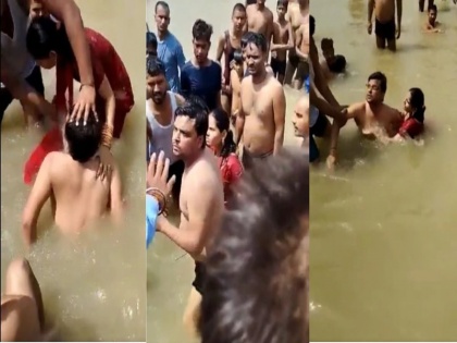 young couple beaten in uttar pradesh ayodhya saryu river after husband kiss wife while bathing video viral | सरयू नदी में नहाते समय नव दंपति के किस करने से मचा बवाल, भीड़ ने पति की कर पिटाई, कहा ऐसी हरकत यहां नहीं चलेगी